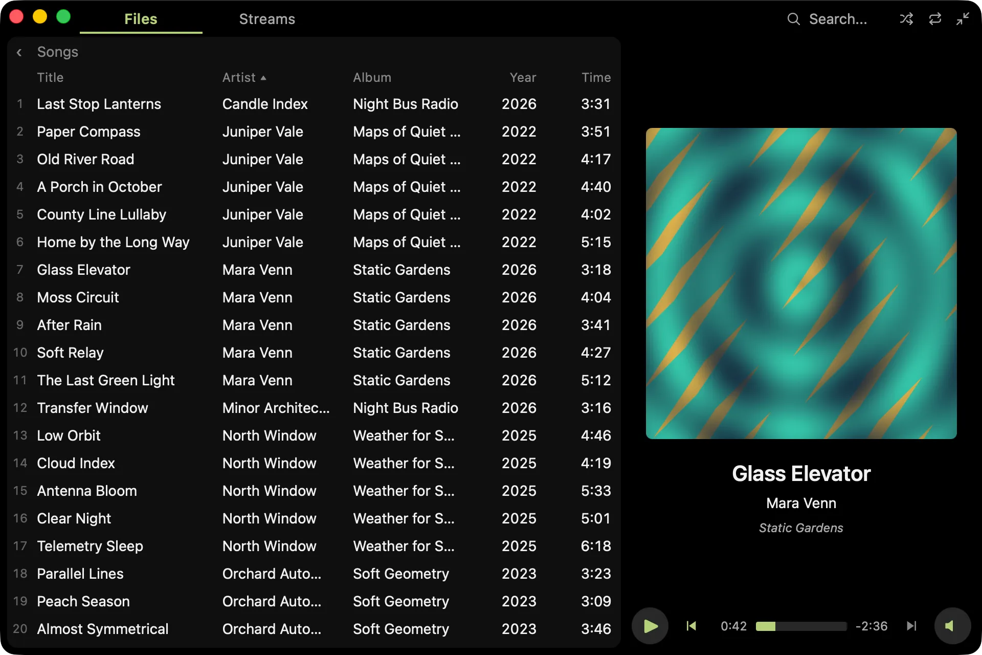 The Files panel widened to show the Songs view with column headers, sorted by artist, and a Year column added