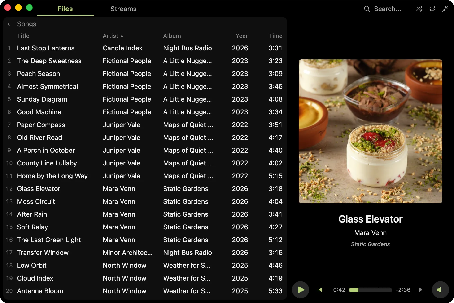 The Files panel widened to show the Songs view with column headers, sorted by artist, and a Year column added