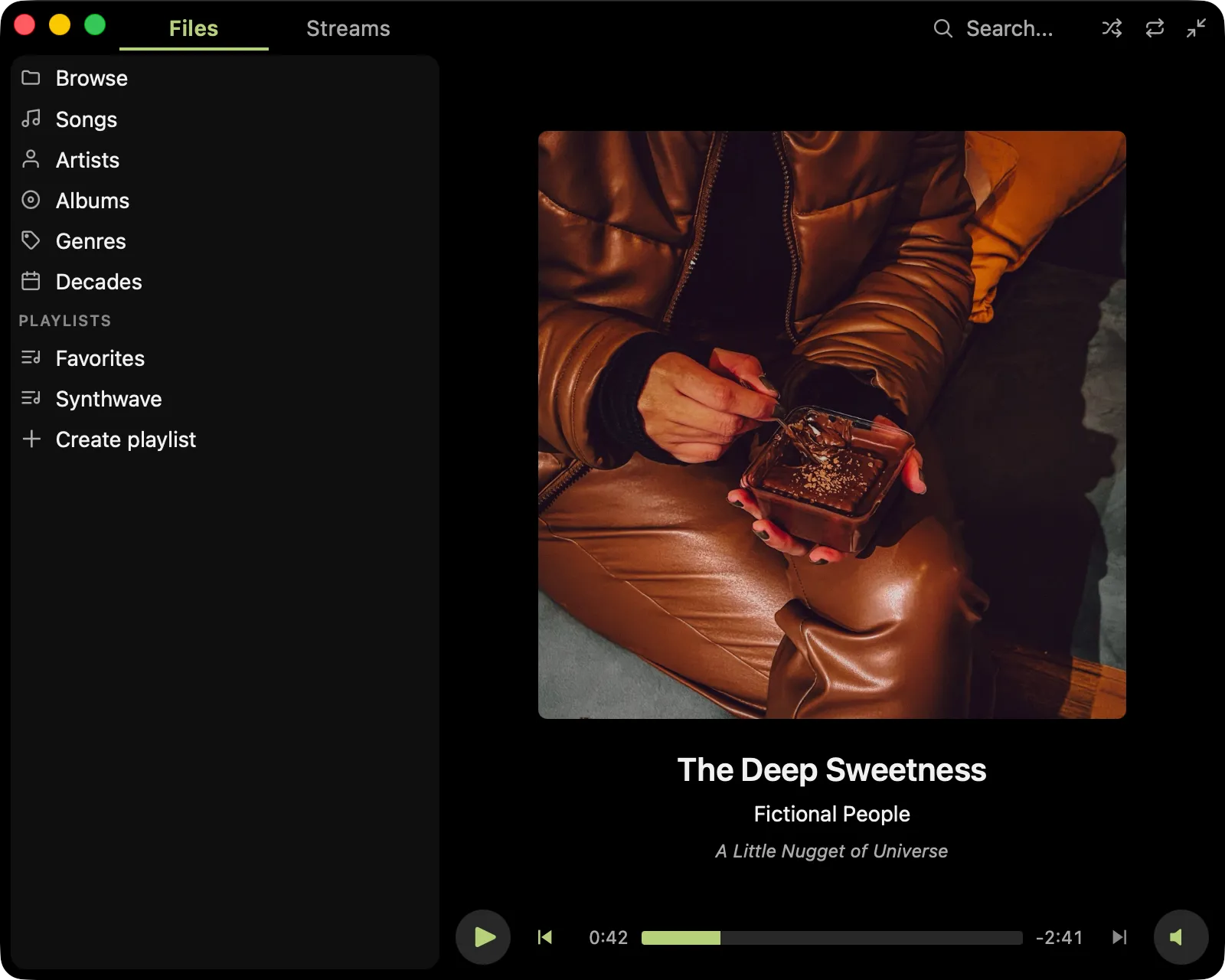 Pudding Desktop in its dark theme, showing the Files panel with library views and playlists, album artwork, and playback controls.
